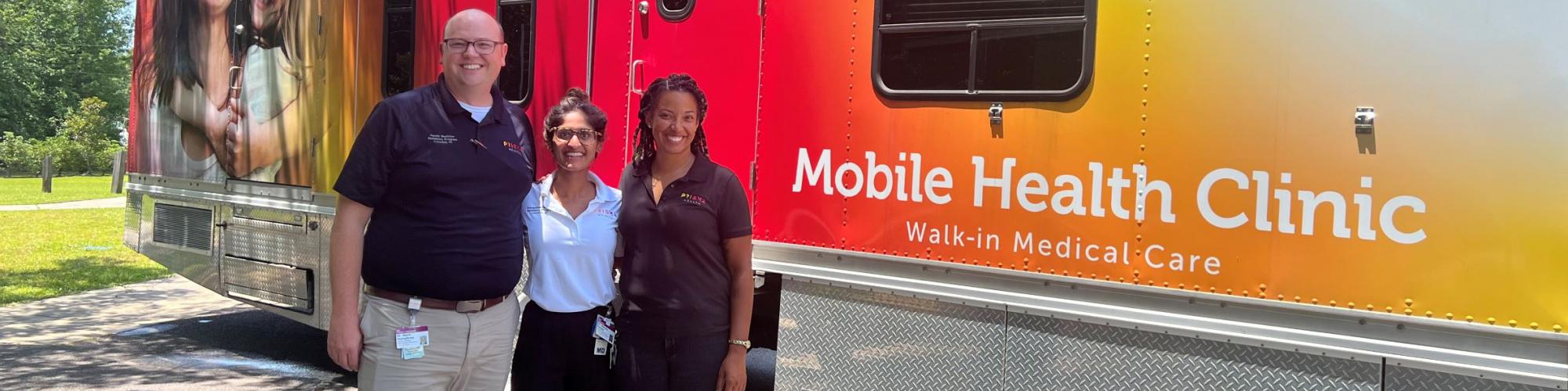 Team in front of a mobile health clinic