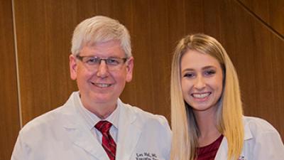 Second-year student Kylie Stevens (pictured with School of Medicine dean Les Hall) is a recipient of the Rural Health Student Recruitment Loan, which encourages health profession students to pursue rural practice.