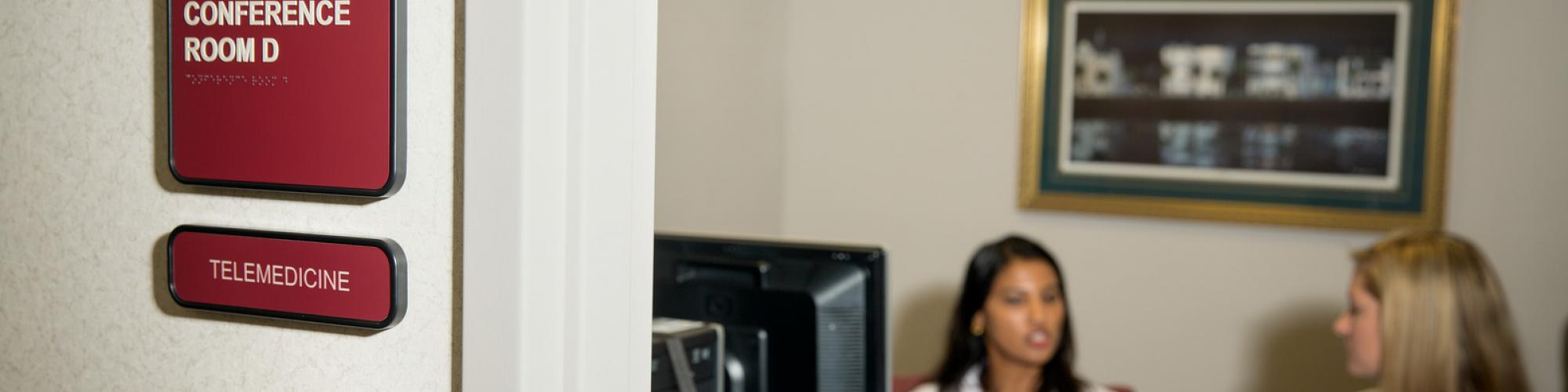 Doctors in a telemedicine room